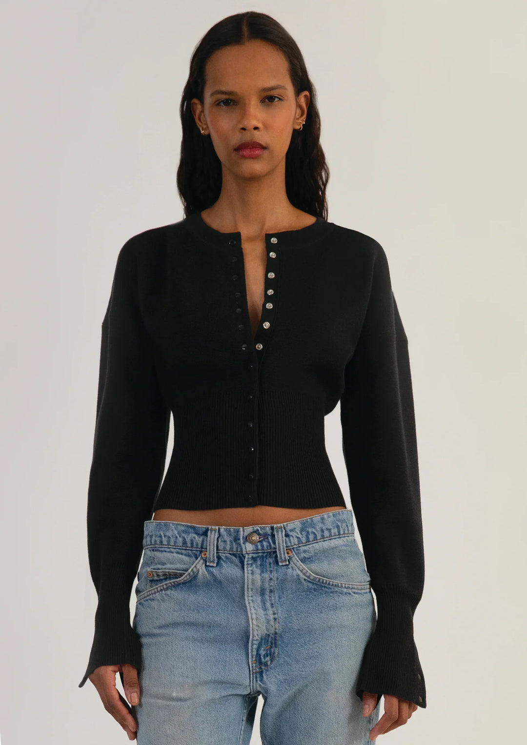 Elegant knitwear: women's long sleeve cropped cardigan with a classic button front.