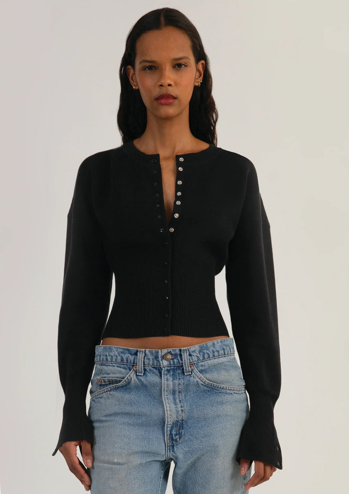 Elegant knitwear: women's long sleeve cropped cardigan with a classic button front.