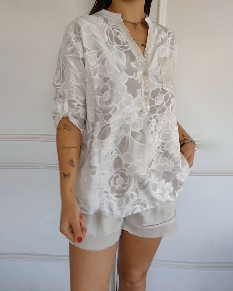 Soft fabric of sophisticated women's floral blouse. Elegant long sleeve top, versatile style.