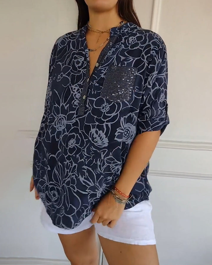 White floral women's blouse, elegant long sleeve top. Sophisticated for casual chic style.