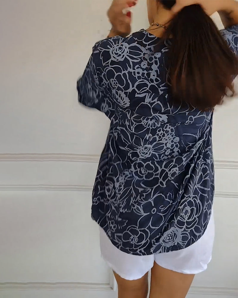 Women's versatile floral blouse styled casually. Elegant long sleeve top for everyday chic fashion.