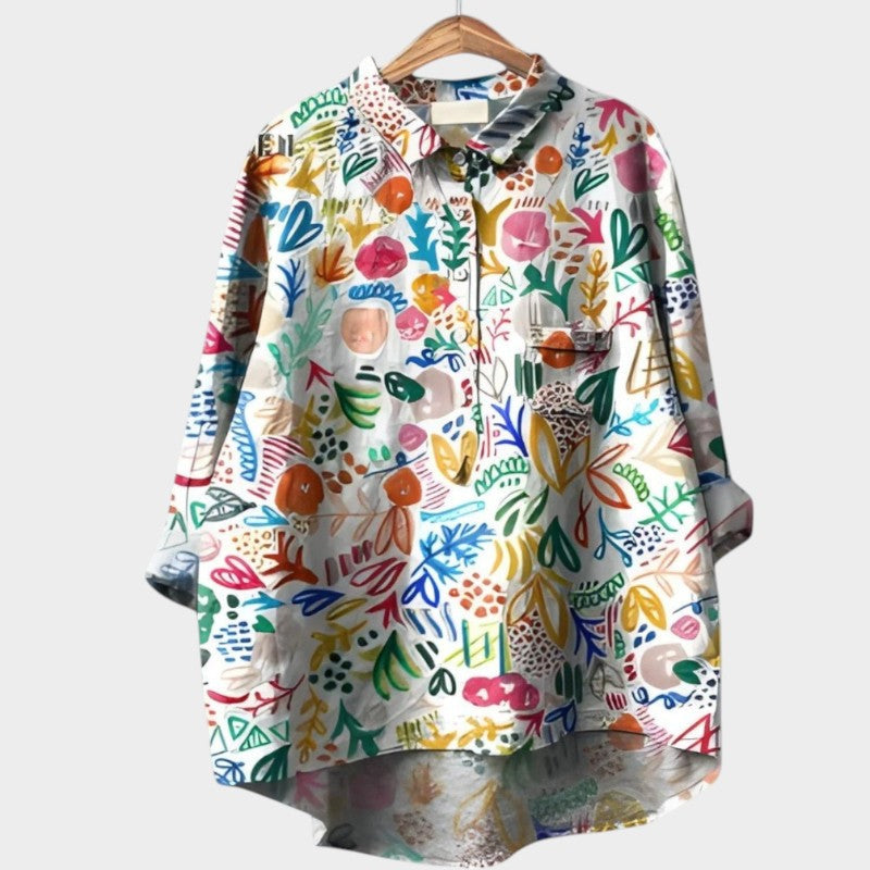 Feminine nature-inspired floral blouse, an elegant long-sleeve top for women's comfort.