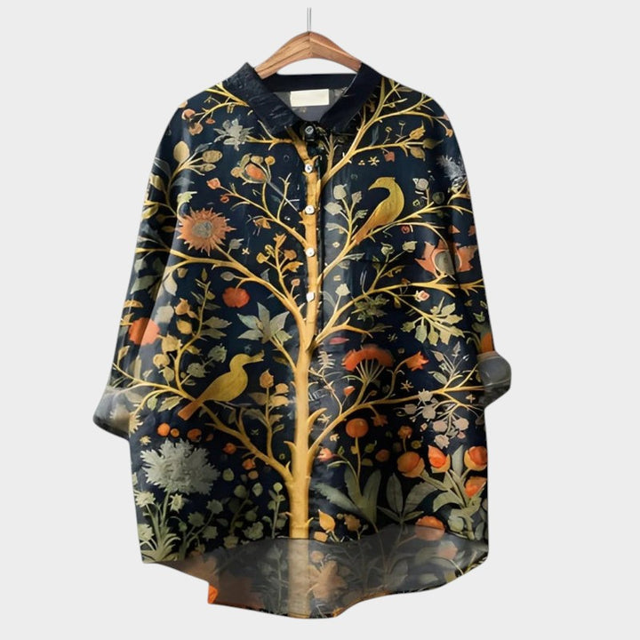 Button-down women's blouse with elegant floral print, versatile for both office & casual wear.