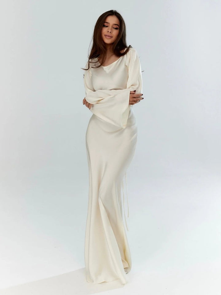 Elegant women's long sleeve maxi dress for formal occasions. Flowy, chic evening gown.