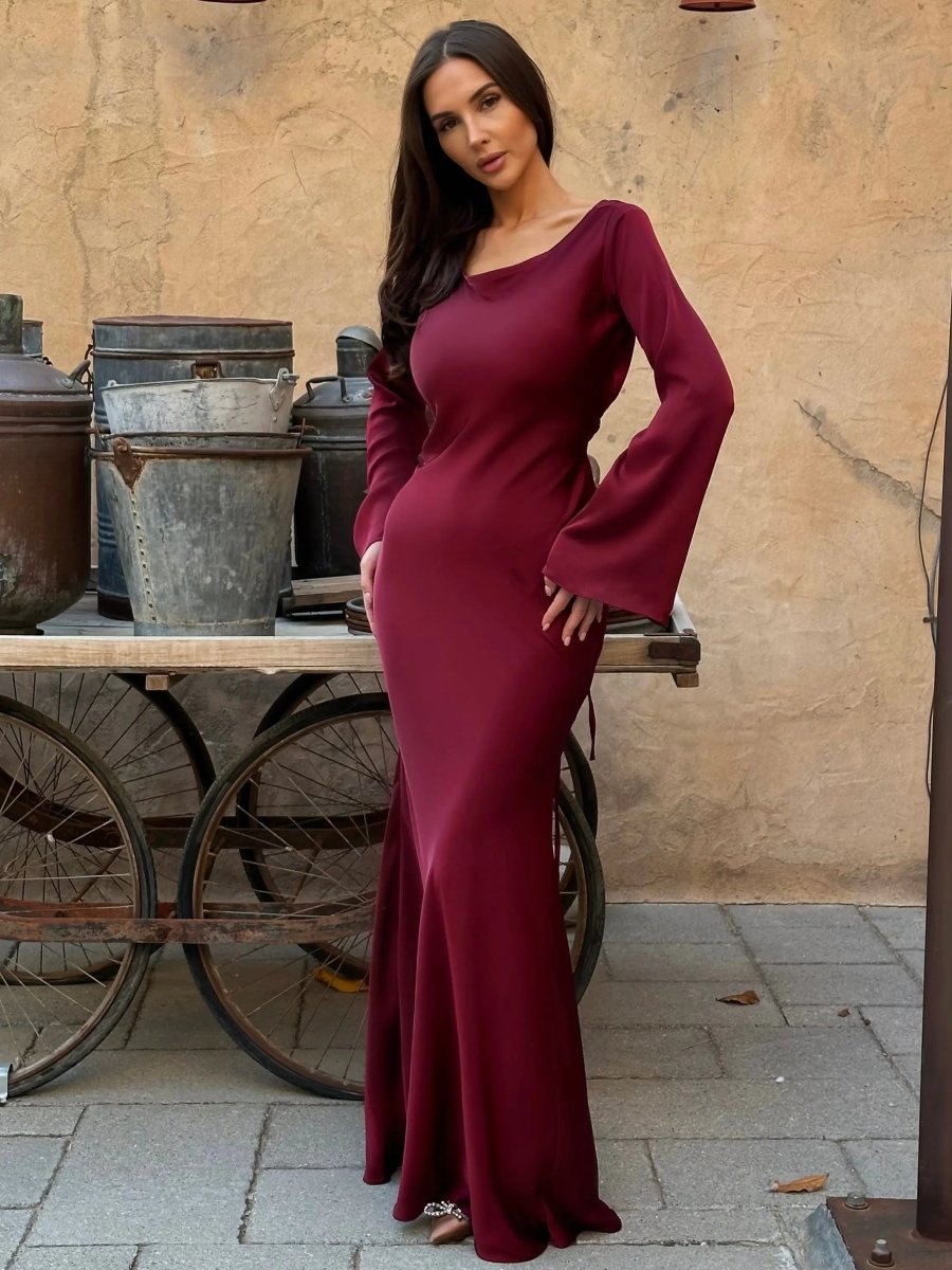 Women's elegant long sleeve maxi dress, featuring a flattering fit and floor-length design.