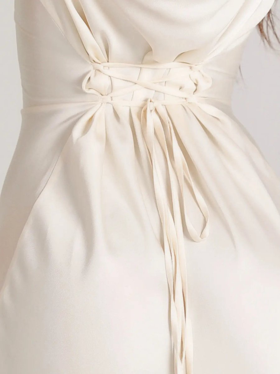 Detailed view of the elegant long sleeve maxi dress fabric. Perfect for women's formal occasions.