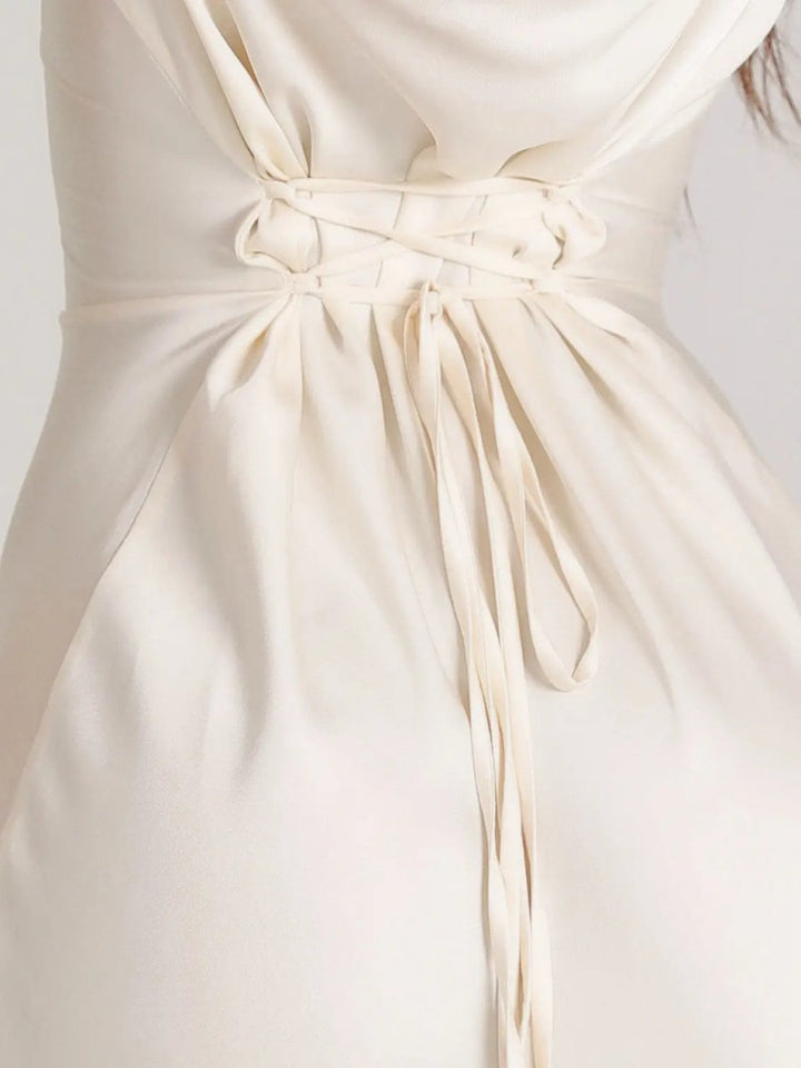 Detailed view of the elegant long sleeve maxi dress fabric. Perfect for women's formal occasions.