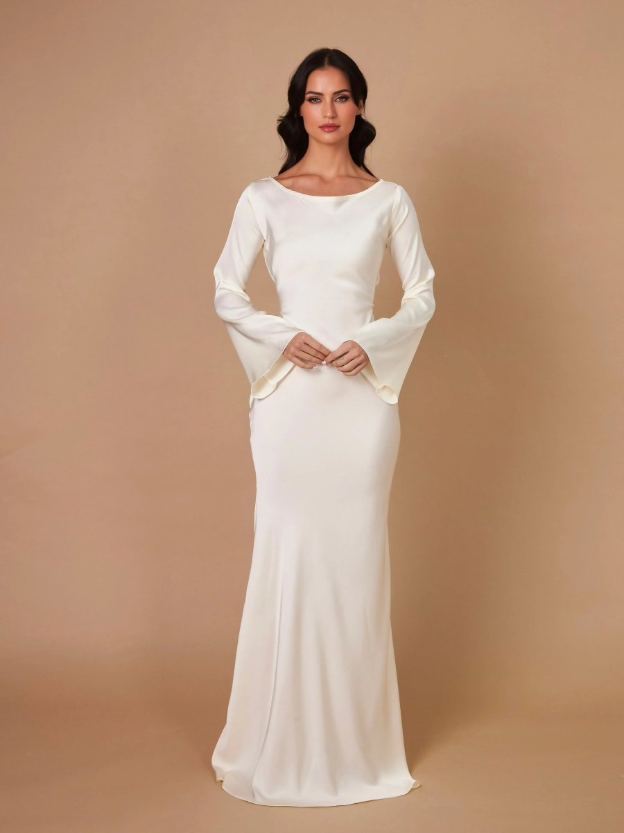 Woman models an elegant long sleeve maxi dress, perfect as a formal evening gown or party dress.