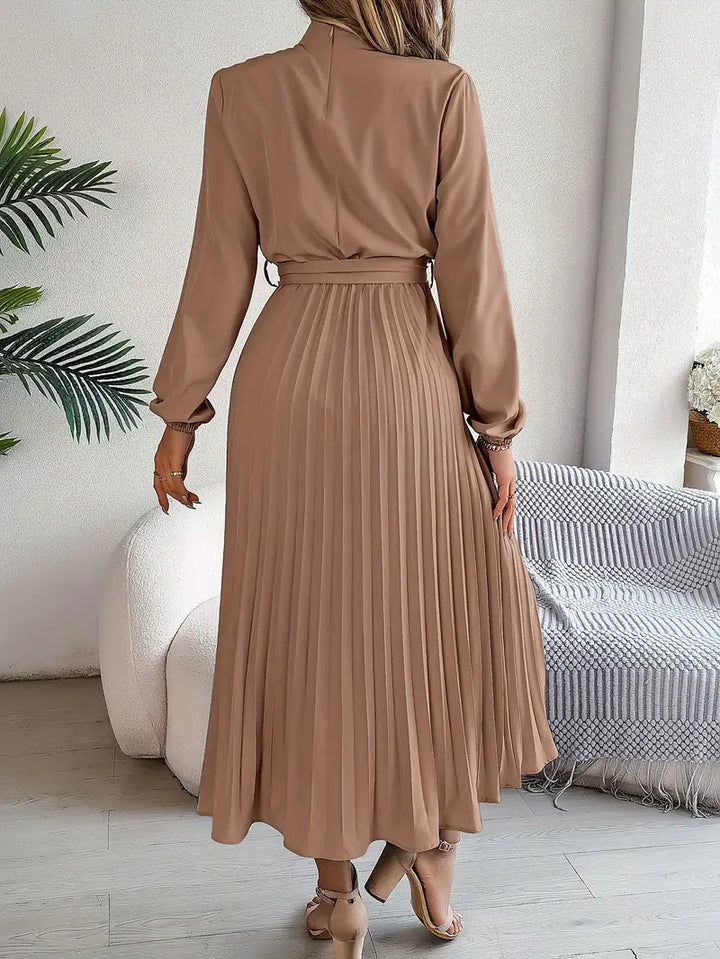 Women's elegant long-sleeve belted midi dress, a sophisticated and versatile choice.