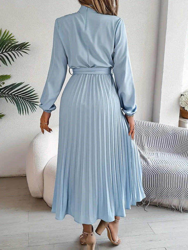 Stylish long-sleeve belted midi dress for women, featuring a flattering pleated skirt design.