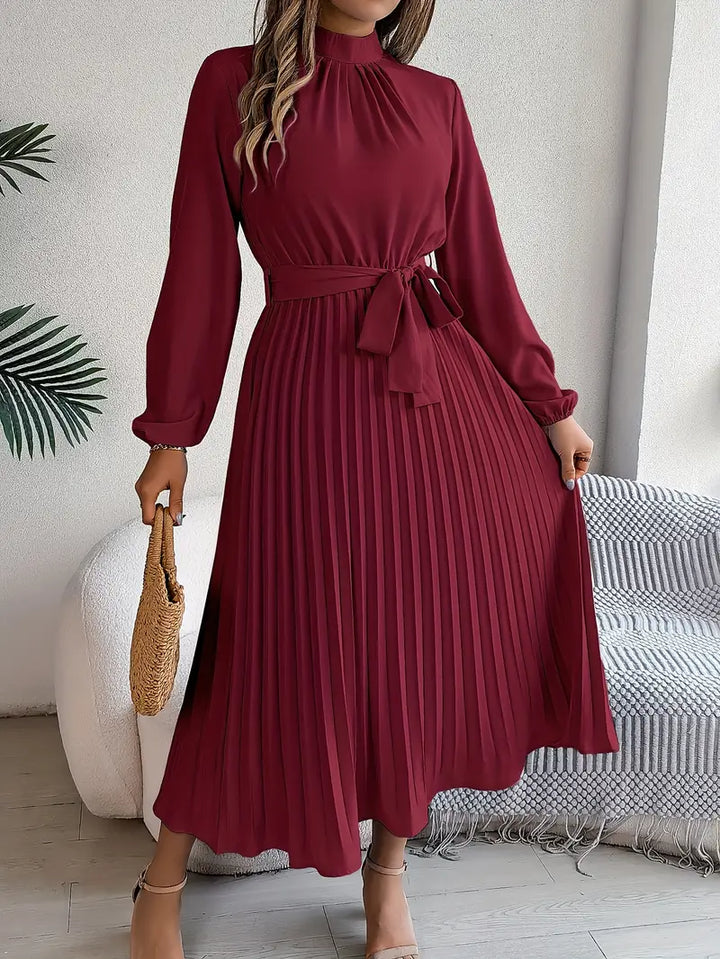 Women's chic pleated long-sleeve midi dress, with a stylish belted waist for a flattering silhouette.