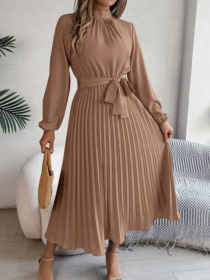 Flattering women's long-sleeve belted midi dress, elegant design perfect for any event.