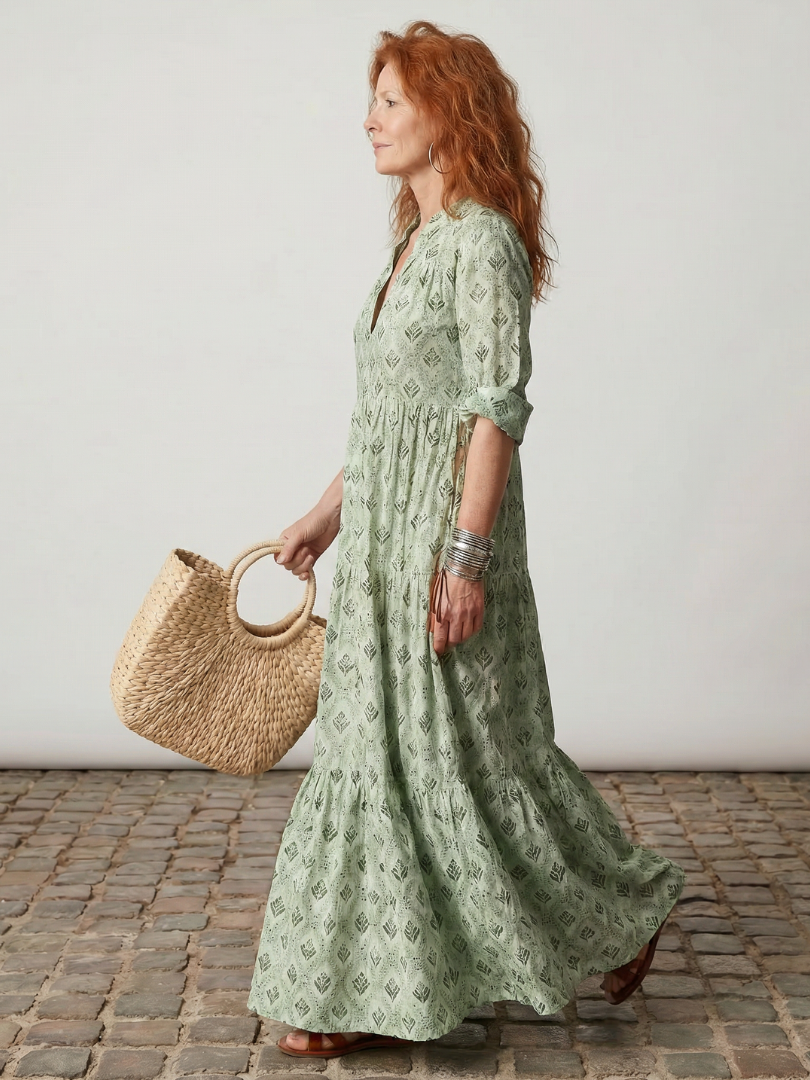 Versatile women's floral printed maxi dress, featuring a stylish notch neck & long sleeves for elegant summer fashion.