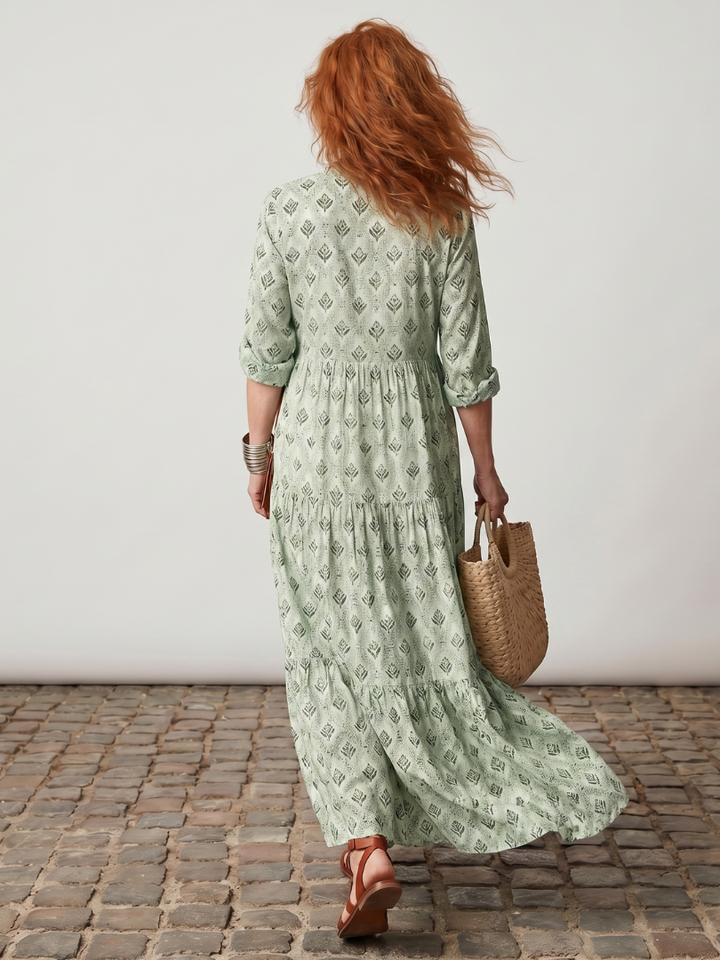 Women's long sleeve maxi dress in a beautiful print, designed with a chic notch neck for a touch of elegance.
