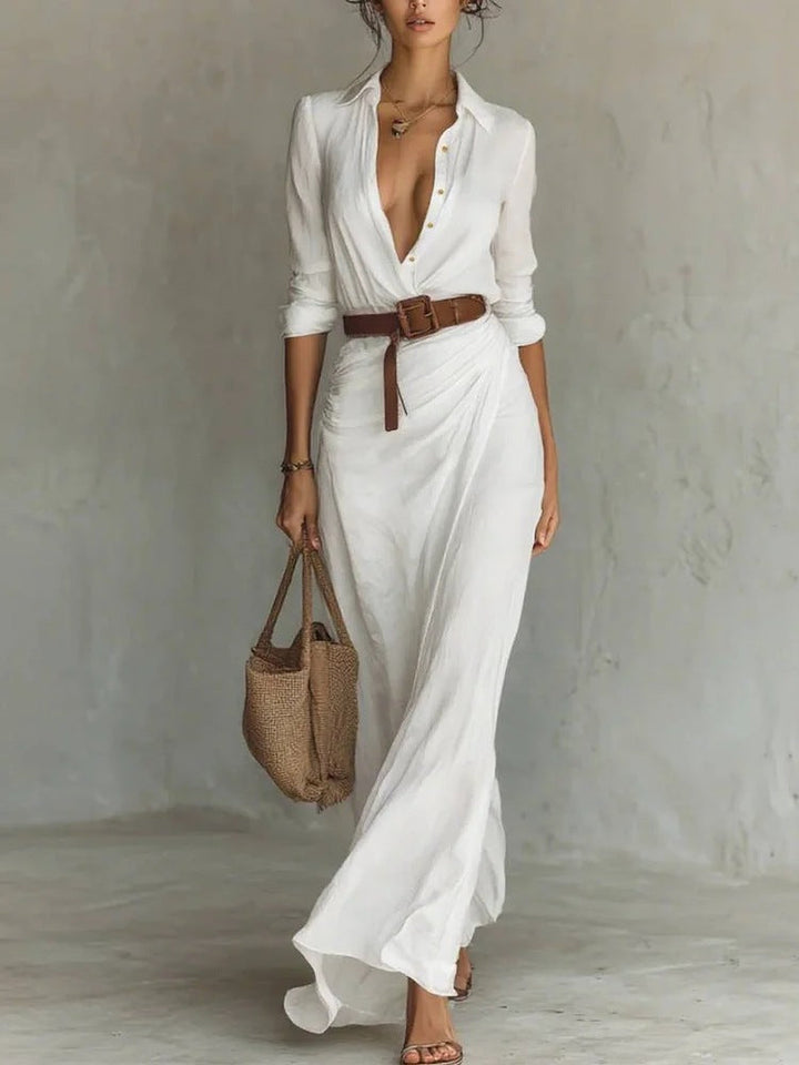 Close-up of elegant ruched belted maxi shirt dress, showing waist detail, long sleeves, and button-front style.