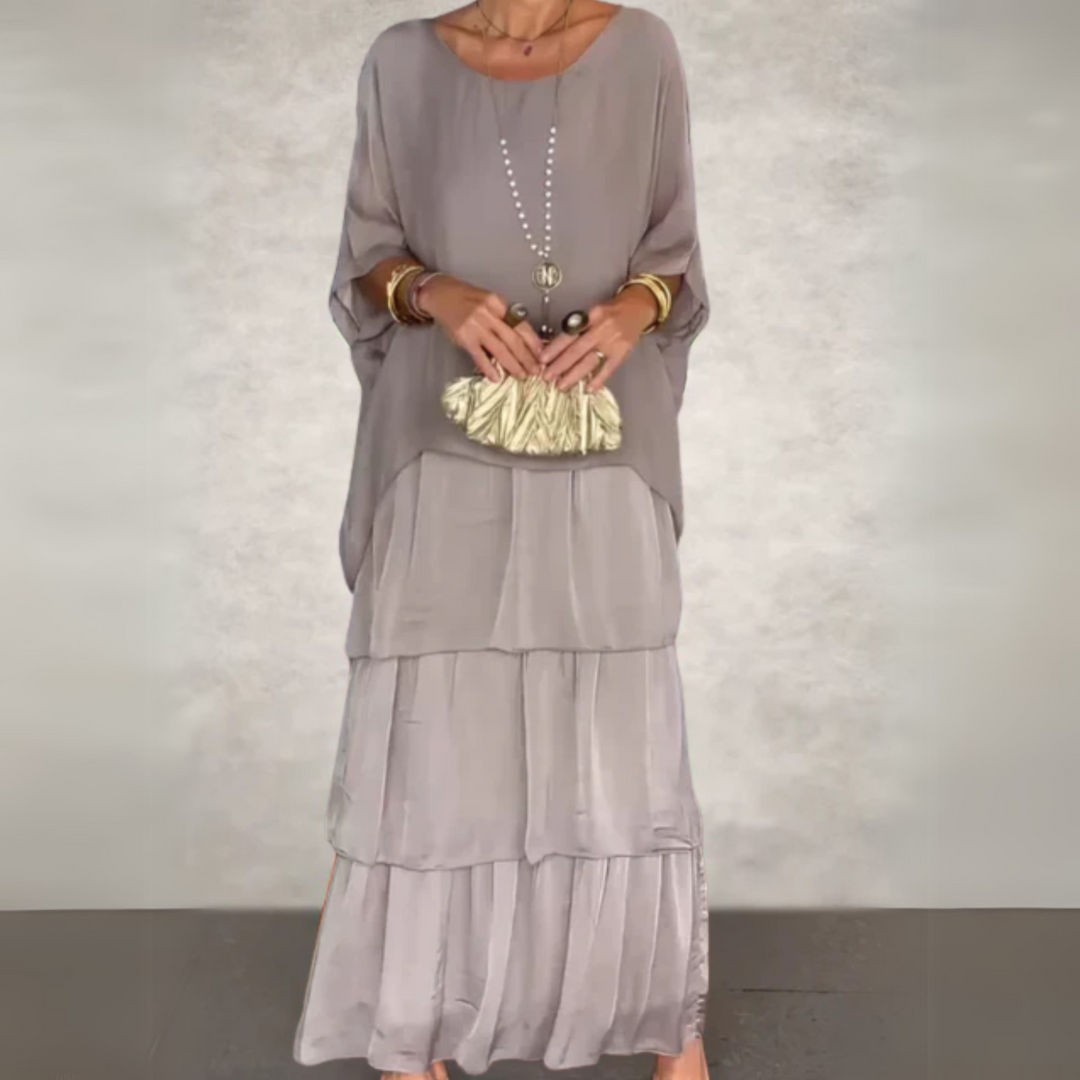 Women's tiered maxi dress with elegant long sleeves, flowing design for a flattering relaxed fit.