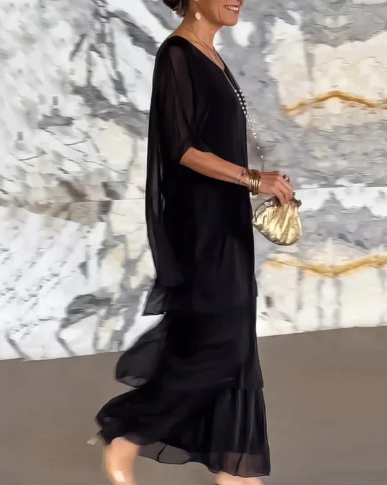 Women's elegant long sleeve tiered maxi dress, comfortable relaxed fit, ideal for warm weather.