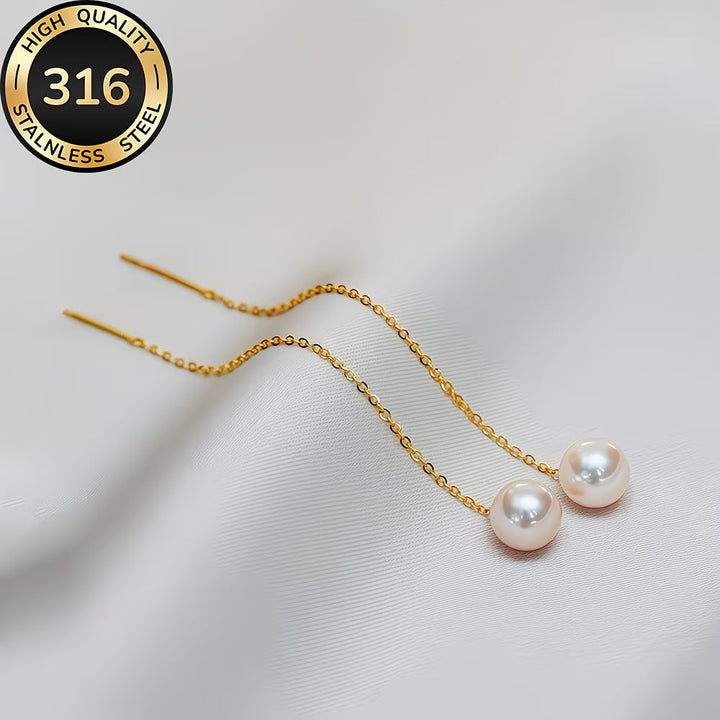 Elegant women's long tassel pearl drop earrings, perfect for a sophisticated look. Fashion accessory.