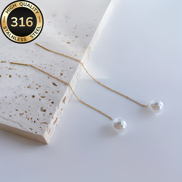 Fashionable women's long pearl drop earrings with delicate tassels. Elegant statement accessory for any occasion.