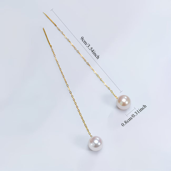 Stylish women's pearl tassel drop earrings, long and elegant. A chic fashion accessory for special events.