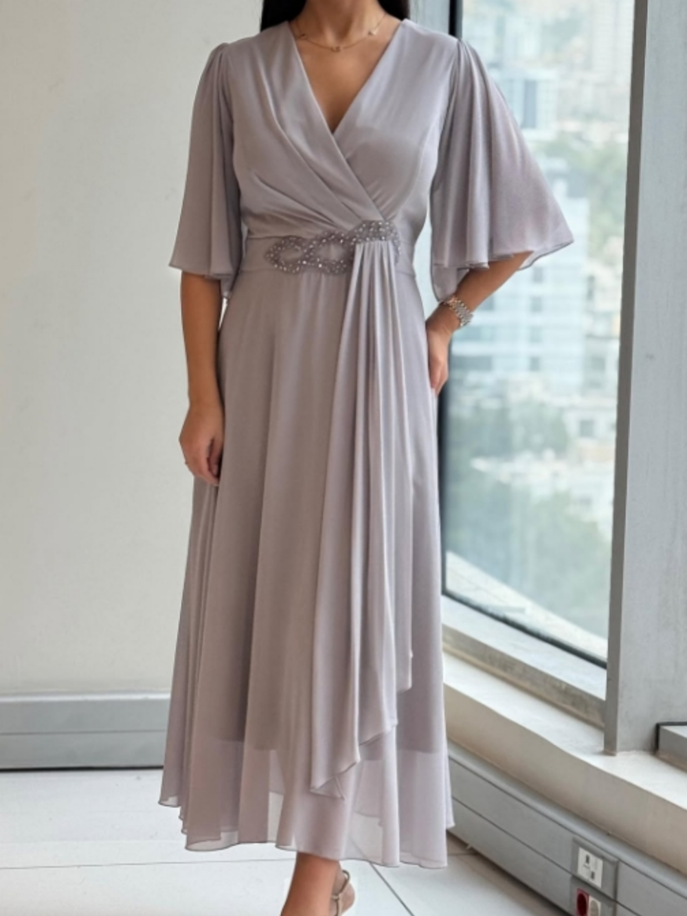 Elegant women's long V-neck maxi dress, perfect for formal evening events or special occasions. Flowing design.