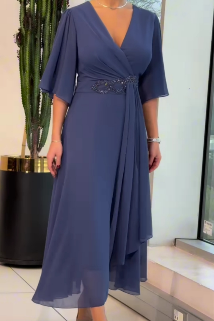Flowing women's long party dress with a stylish V-neck. Ideal for evening wear, formal events & special occasions.