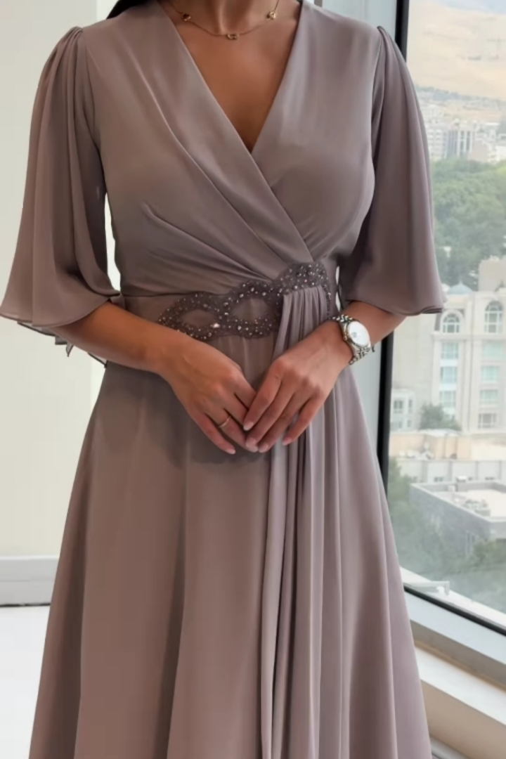 Stunning women's long maxi dress with a deep V-neck, suitable for formal occasions, evening parties, and elegant events.