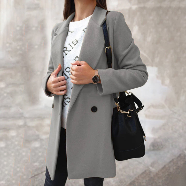 Elegant women's long winter coat. Perfect classic outerwear for cold weather, versatile for everyday or office attire.
