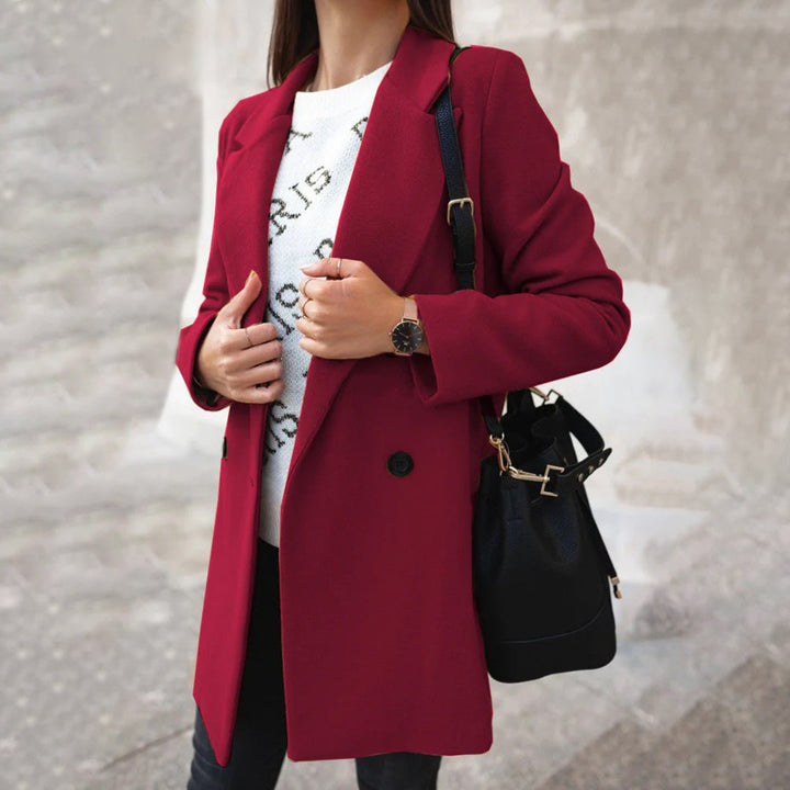 Full-length elegant women's winter coat. Stylish outerwear, suitable for cold weather, everyday wear, and office.