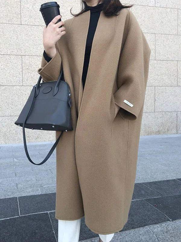 Elegant women's long coat in black, perfect for winter fashion.