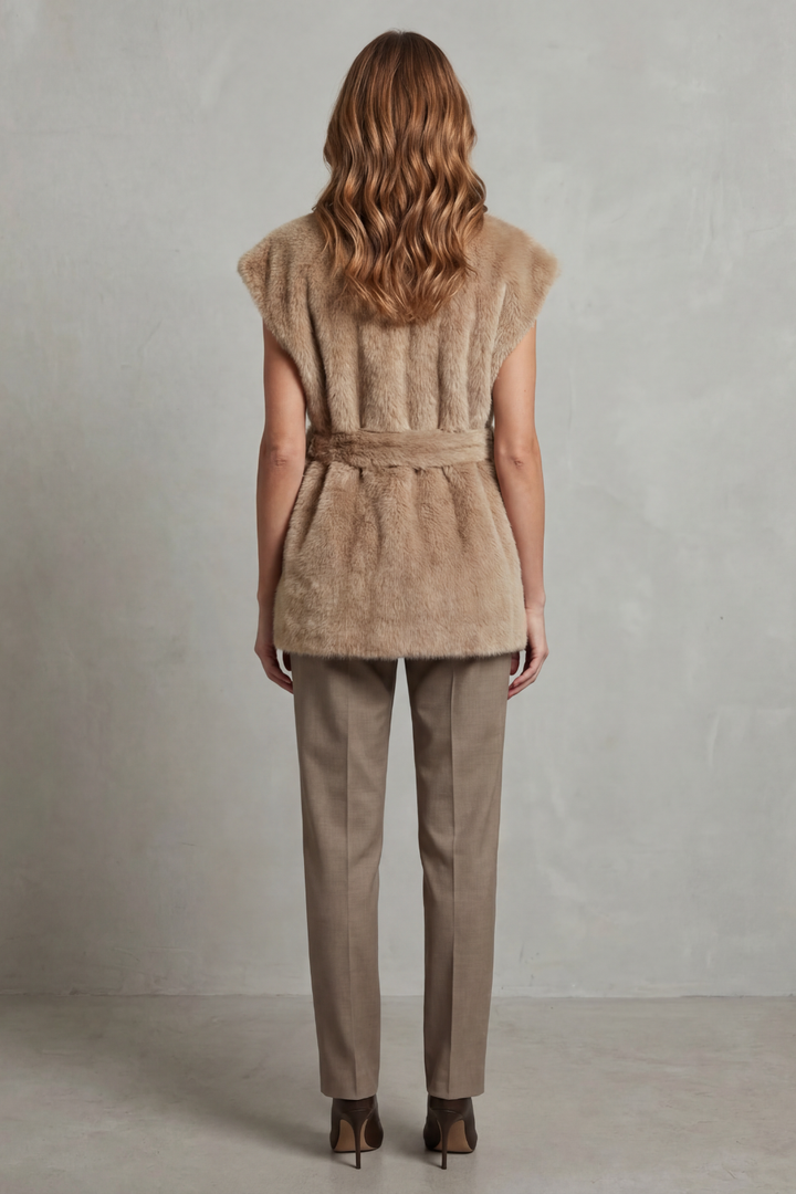 Chic women's elegant longline plush vest. This versatile brown outerwear features a flattering adjustable belt.