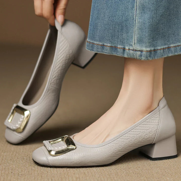 Elegant women's low block heel pumps, perfect for all-day comfort, featuring a chic design.