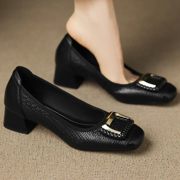 Slip-on women's comfort block heel pumps, featuring a low heel design for easy wear and style.