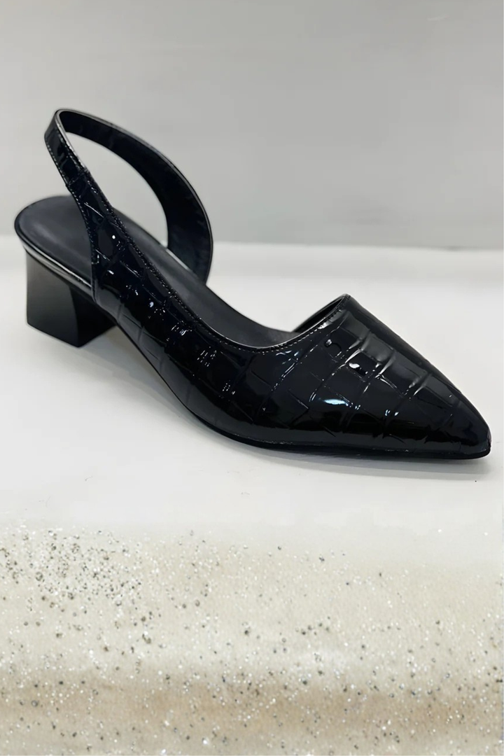 Women's elegant low block heel slingback pumps in a timeless design with a sophisticated pointed toe.