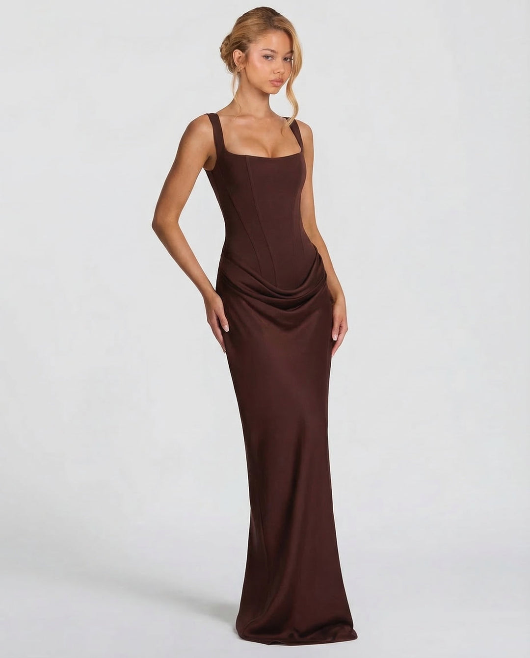 Women's elegant maxi dress, long and formal, with a chic corset-style top for evening wear.