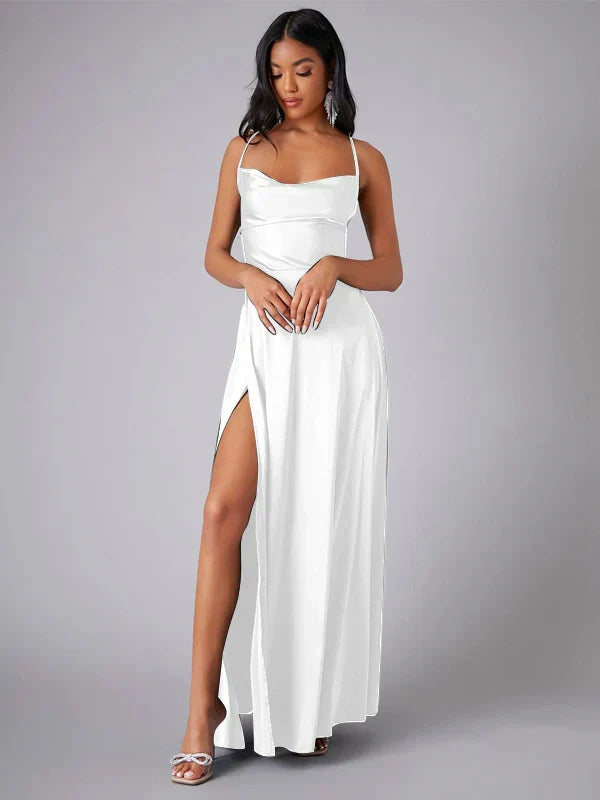 View of women's elegant evening dress, highlighting the dramatic high slit and beautiful open back design.