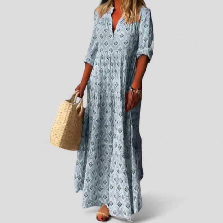 Elegant women's maxi dress with roll-up sleeves and vibrant ethnic print, perfect for versatile spring & summer occasions.
