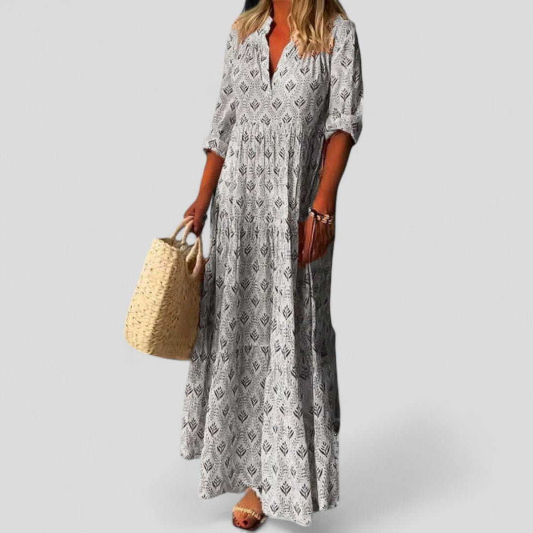 Flowy women's ethnic print maxi dress with roll-up sleeves, ideal for casual, holiday, or modest everyday wear.
