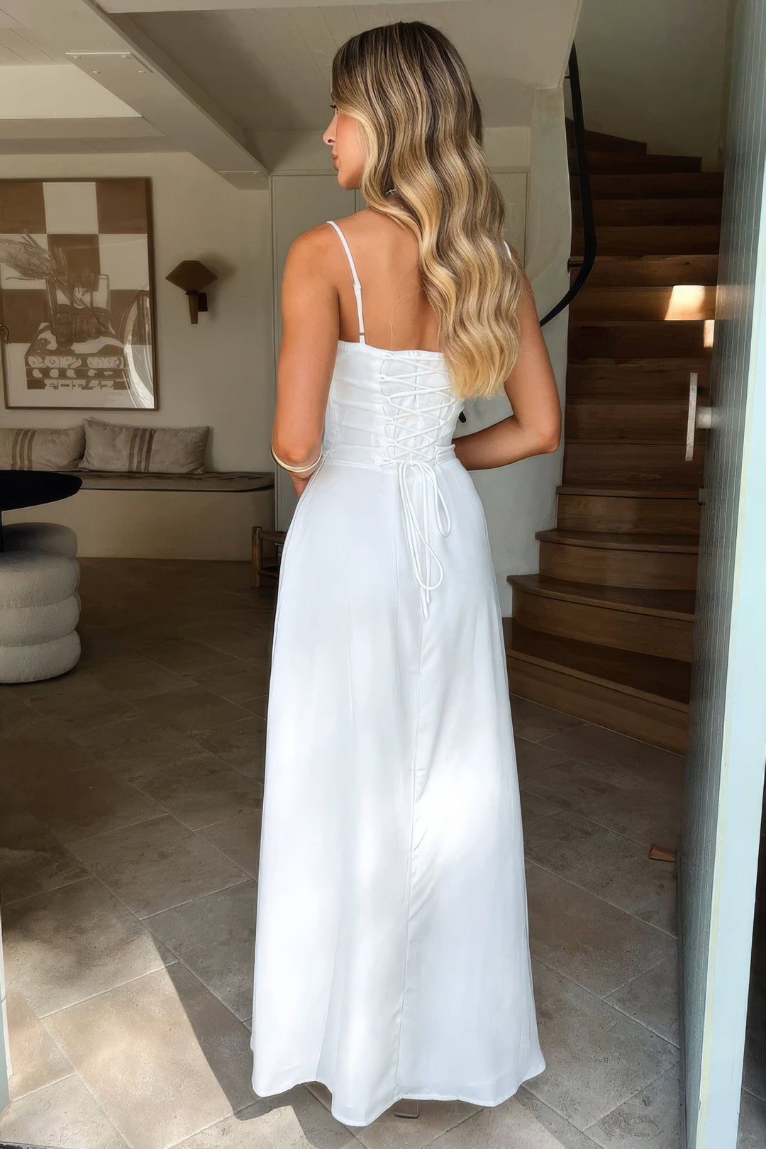 Sleeveless A-line maxi dress for women featuring a chic sweetheart neck, corset bodice, and stylish tie front.