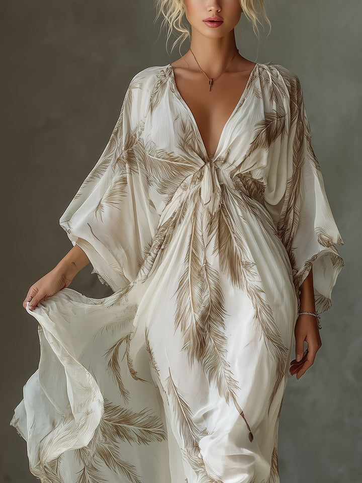 Stylish women's maxi dress featuring an elegant twist front and flowy dolman sleeves. Great for resort or evening wear.