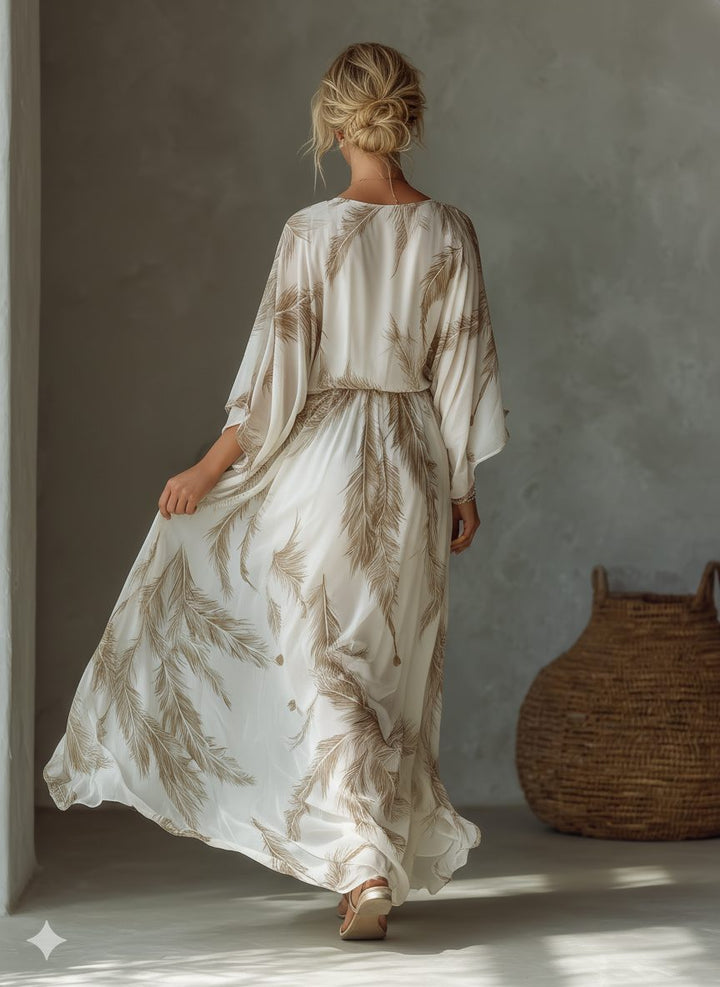 Women's elegant feather print maxi dress with twist front & dolman sleeves. Versatile for summer, resort, or special occasions.