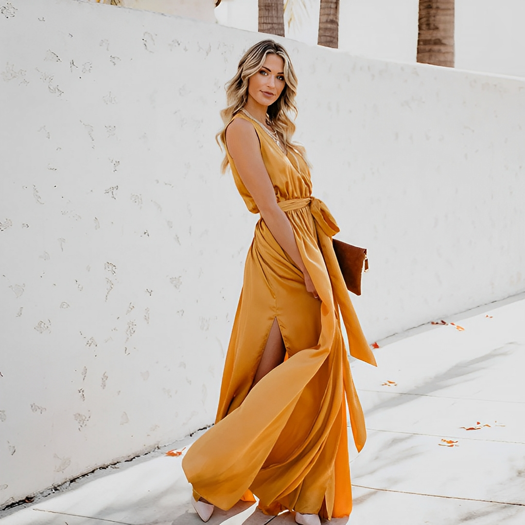 Elegant women's maxi dress with V-neck, sleeveless design, and stylish waist belt for special occasions.
