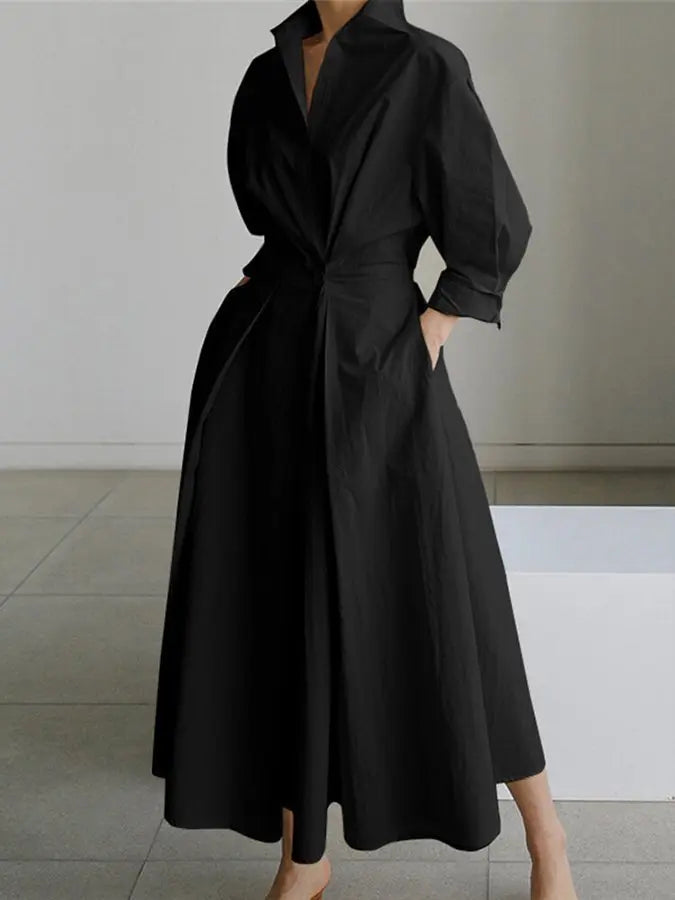 Chic belted maxi shirt dress in a wrap style for women. Features long sleeves for an elegant look.