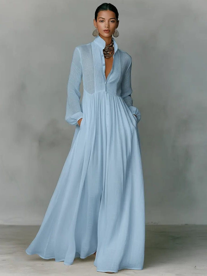 Comfortable women's casual maxi shirt dress, featuring a stylish stand collar, button-front design, and practical pockets.