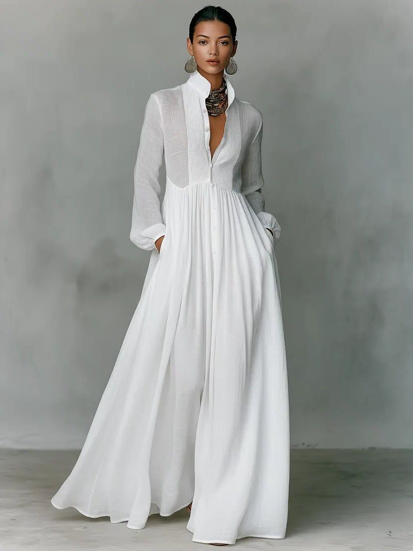 Fashionable women's elegant maxi shirt dress with stand collar, long sleeves, full button placket, and side pockets.