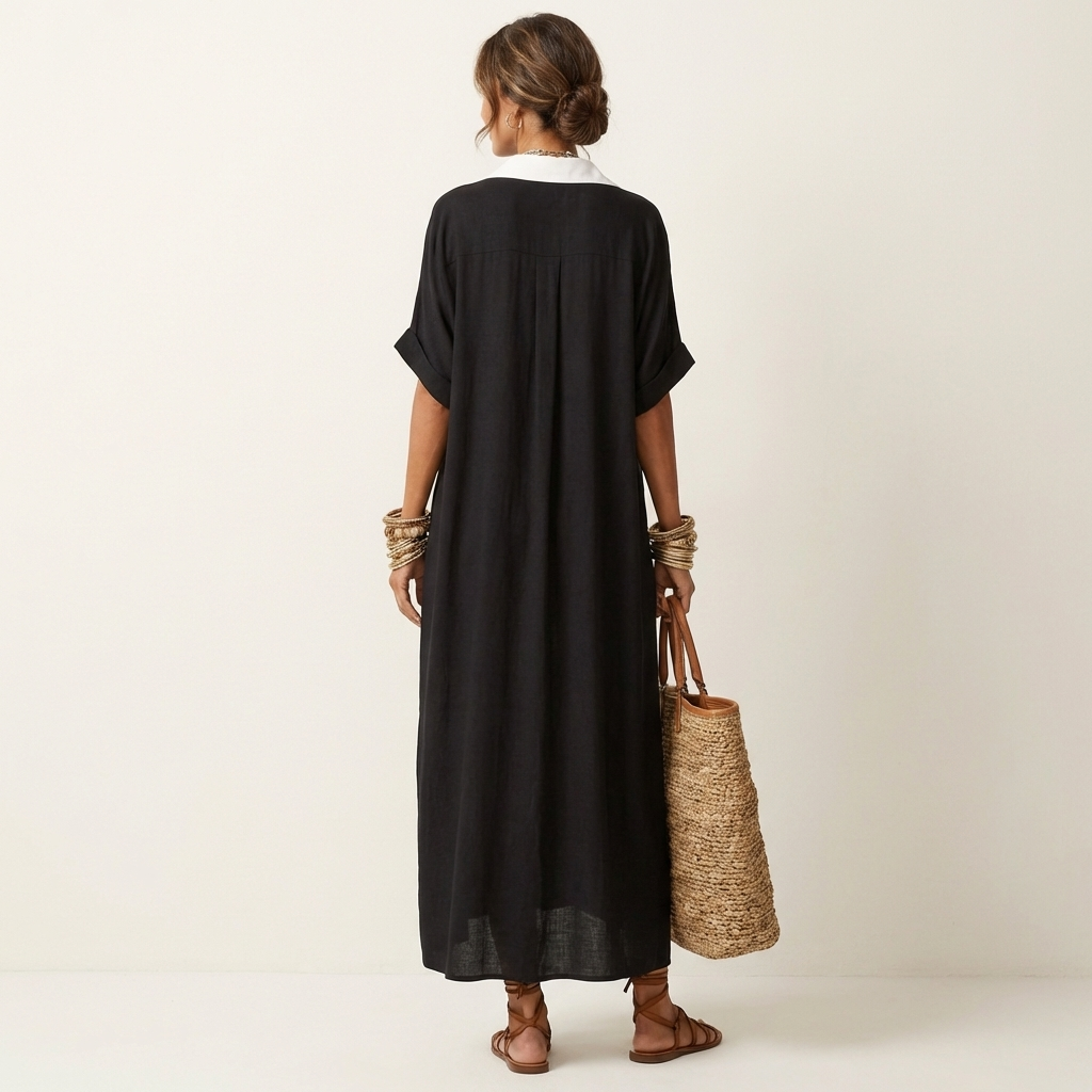Sophisticated women's maxi shirt dress. Elegant contrast collar, short sleeves, & button-front for effortless style.