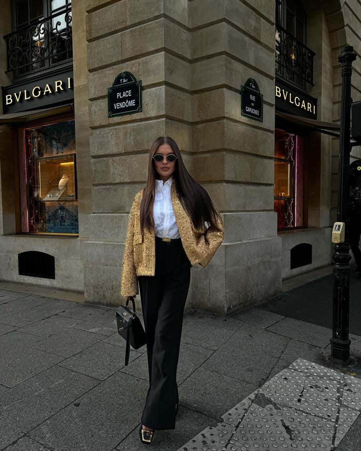 Stand out in this elegant women's metallic mid-season jacket. Tailored fit for chic spring/autumn wear.