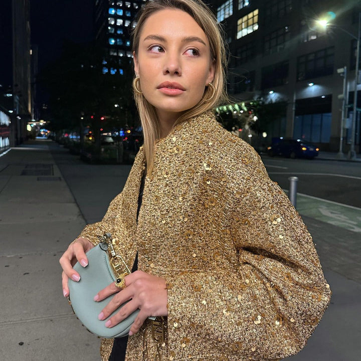 Chic women's metallic jacket, tailored fit. A versatile mid-season statement piece for elegant style.