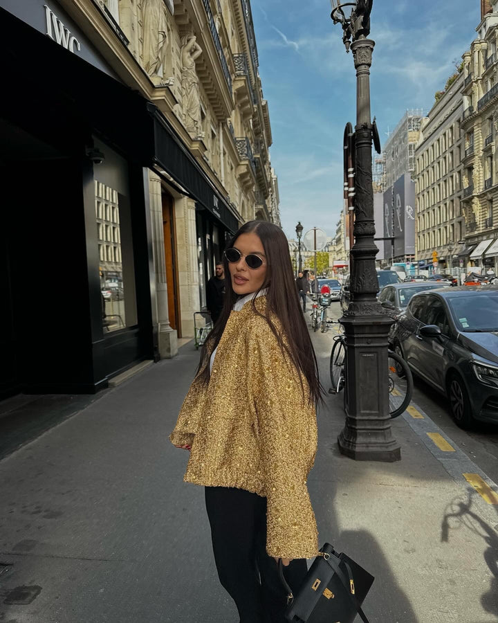 Contemporary women's metallic jacket. Elegant mid-season outerwear with a flattering tailored fit.