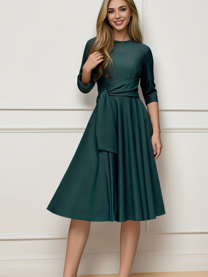Women's elegant midi blouse with a flattering tie waist and bow detail, ideal for professional workwear style.